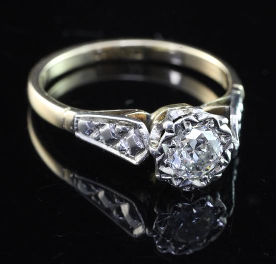 A 1960s 18ct gold and platinum illusion set solitaire diamond ring, size M.